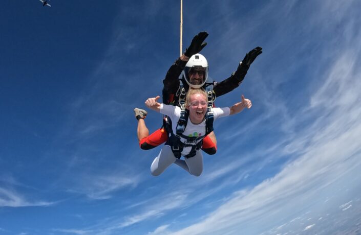 Young woman skydiving and having a great time